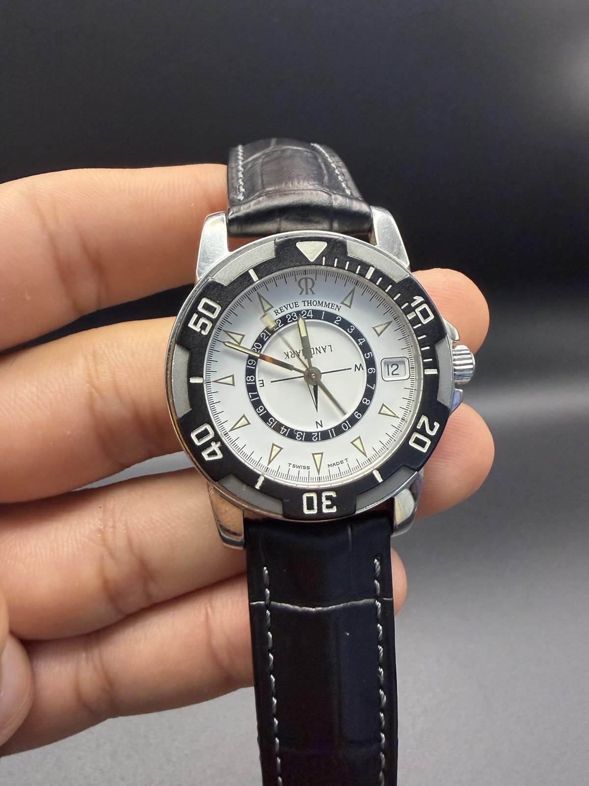 Close-up of the Revue Thommen Landmark dial with 24-hour ring and date window