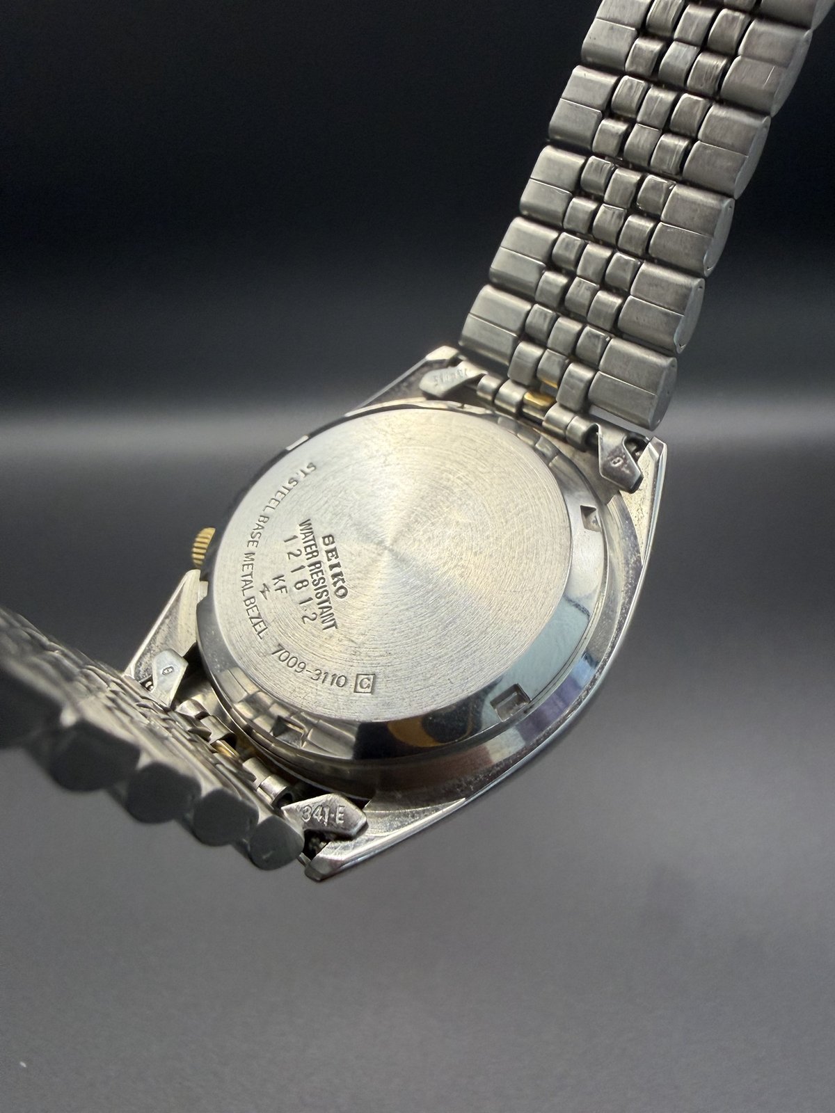 Caseback marked SNXJ92, stainless steel back