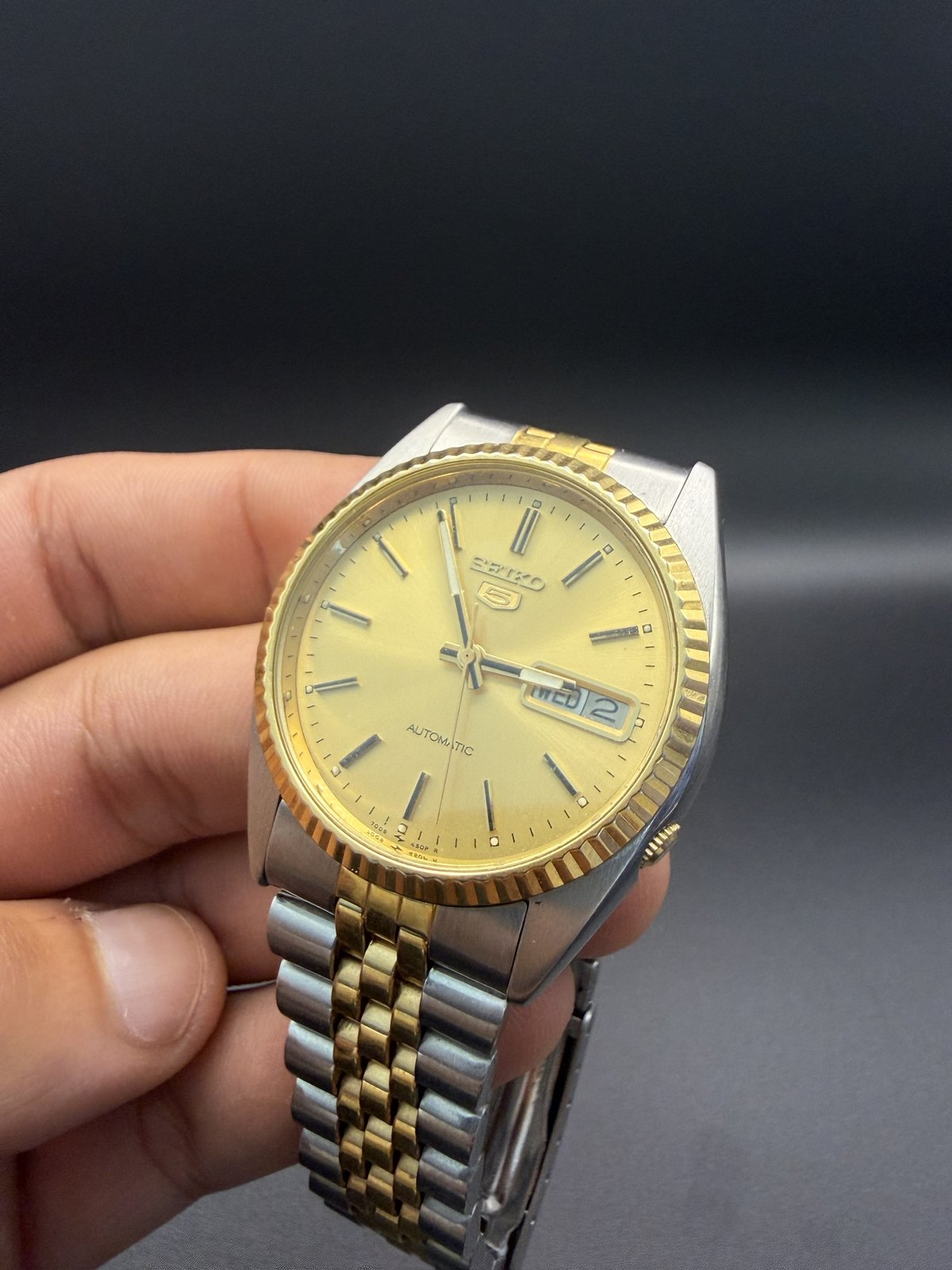 Seiko 5 gold dial with day-date window