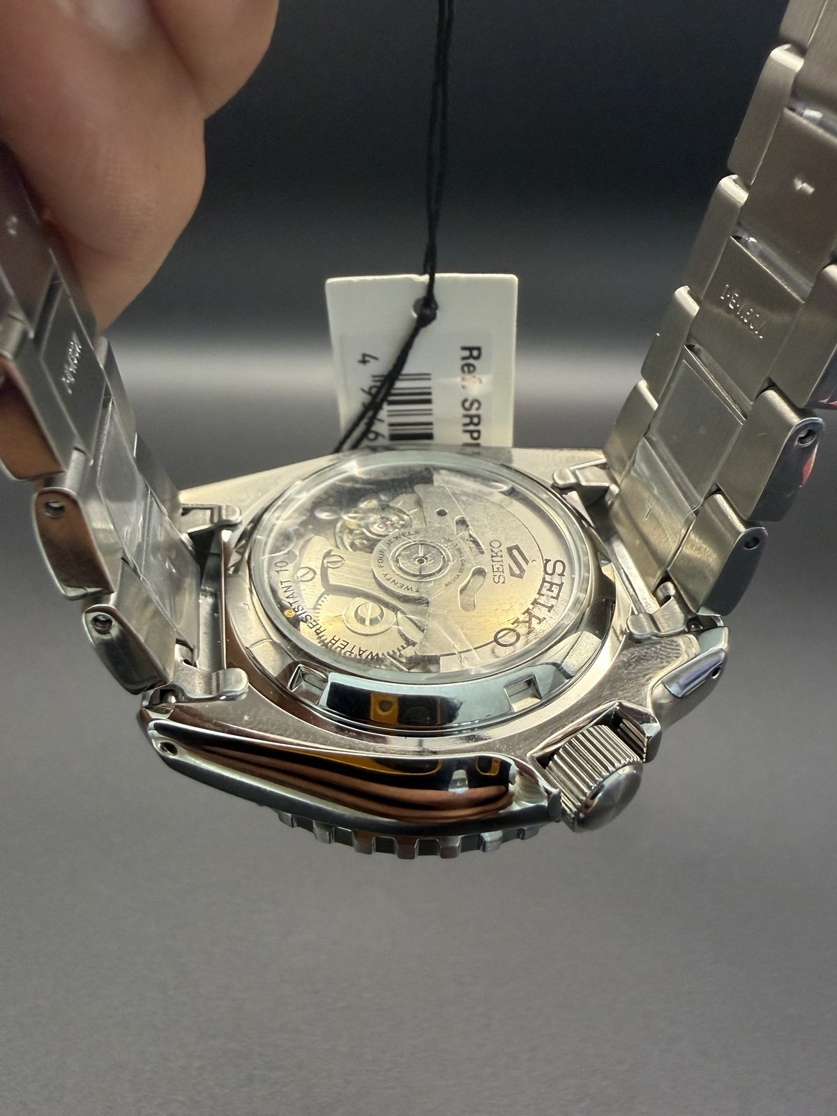 See-through caseback showing the Seiko automatic movement