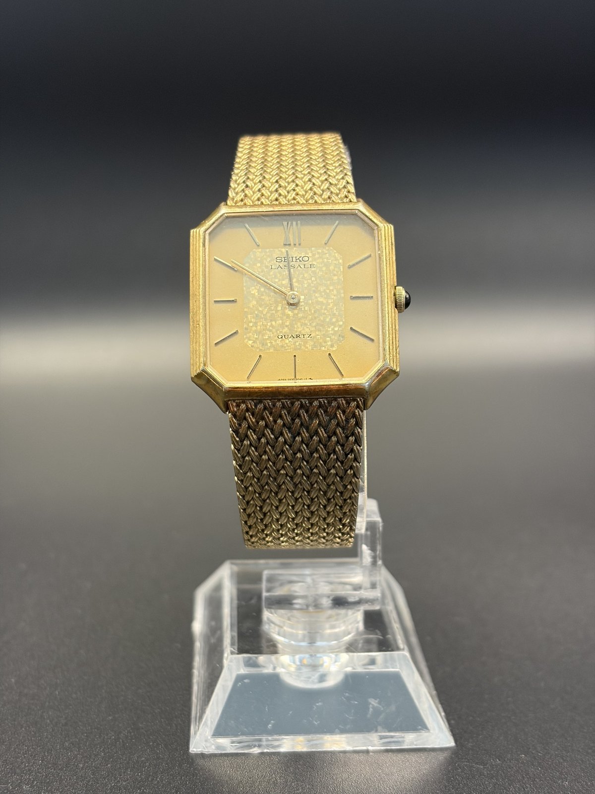 Seiko Lassale 5930-5209 gold-tone quartz watch with mesh bracelet, front view on a stand