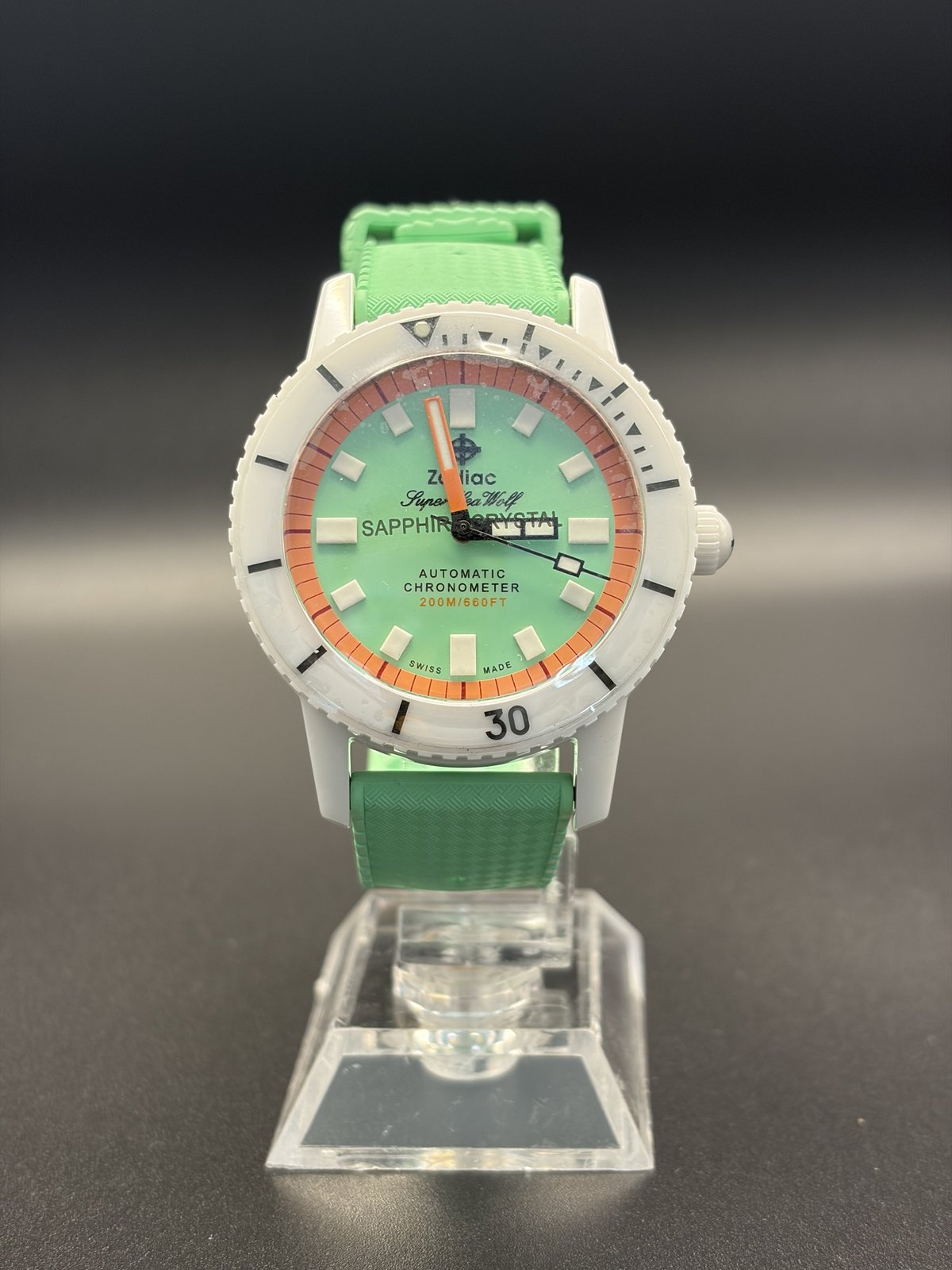 Zodiac Super Sea Wolf ZO9592 dive watch with mint green dial, white case and green rubber strap, on a stand